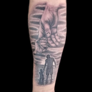 father and son beach landscape tattoo