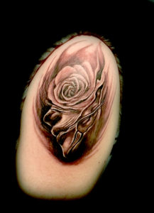 face rose surrealistic tattoo