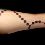 leg rosary tattoo