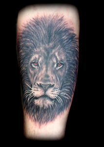 color eyes lion tattoo