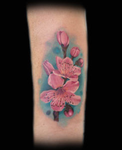 pink cherry blossom realistic tattoo