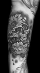 skull lotus flower sunflower tattoo