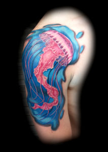 color jellyfish tattoo under water