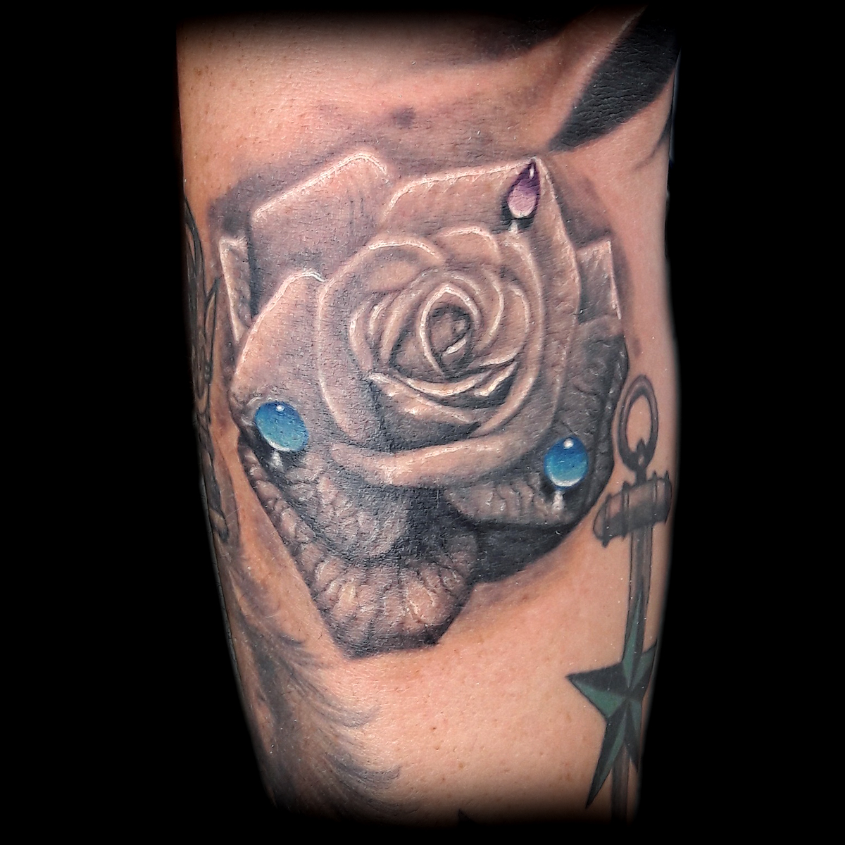 realistic rose tattoo done at Masterpiece Tattoo in San Francisco