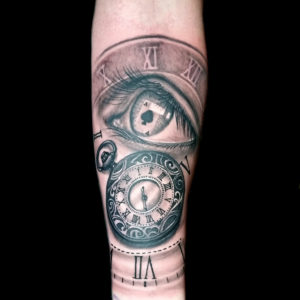 eye clock tattoo forearm