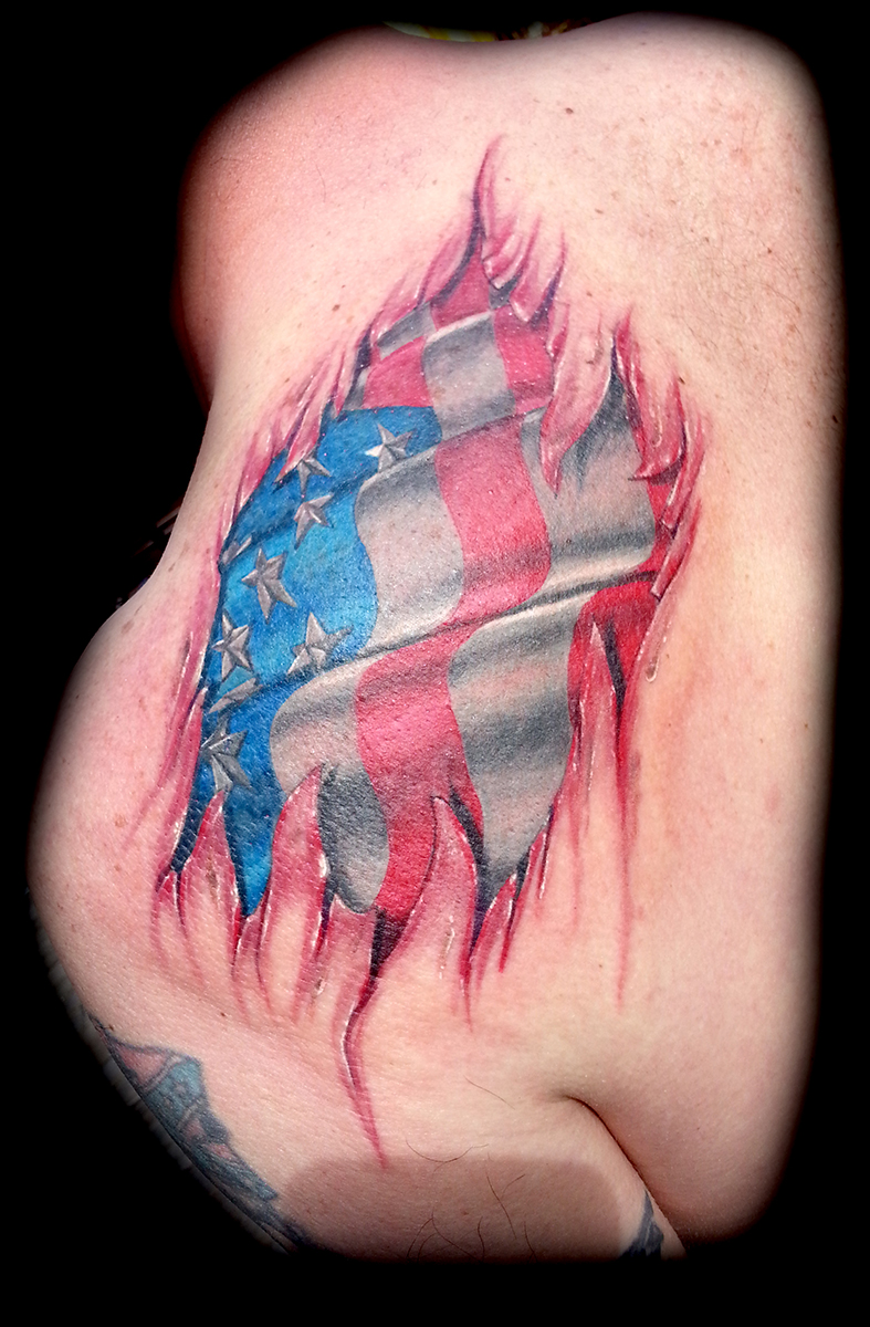 realistic flag tattoo done at Masterpiece Tattoo in San Francisco