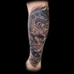 surreal skull eyeball clock tattoo