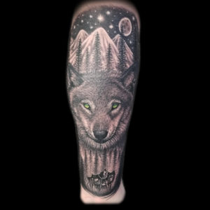 wolf mountains trees tattoo