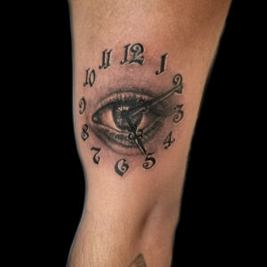 realistic eye clock tattoo