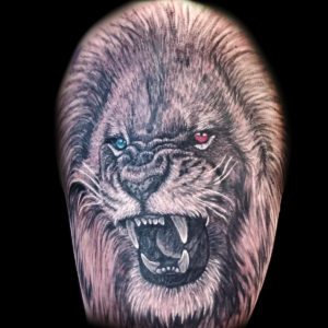 lion different color eyes tattoo