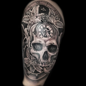 skull flowers clock tattoo