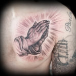 praying hands realistic tattoo
