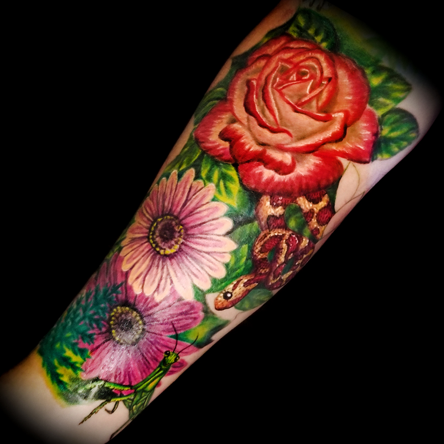 Micro-realistic flower bouquet tattoo located on the