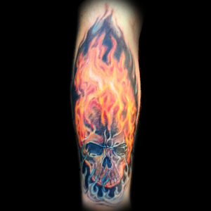skull and fire color tattoo