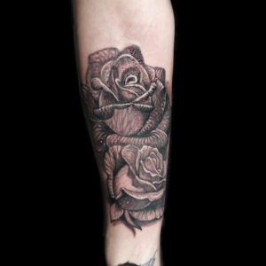 black and grey realistic roses tattoo
