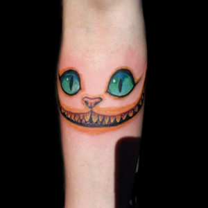 Cheshire Cat tattoo, yes tattoo Cheshire Cat eyes tattoo