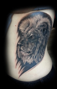 realism lion tattoo