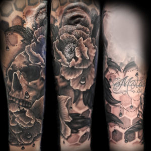 flowers and skulls tattoo