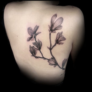 black and white delicate flowers tattoo