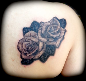 black and grey 3d roses tattoo