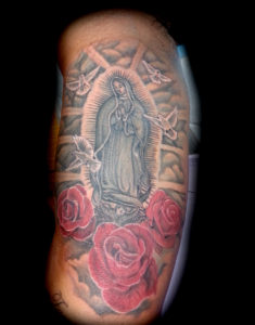 Virgin of Guadalupe and red roses tattoo