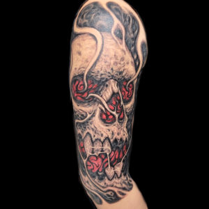 surrealistic skull tattoo red eyes